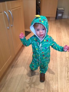 Alistair walking and looking the dude in his Christmas tree onesie. One day he will kill me for this.